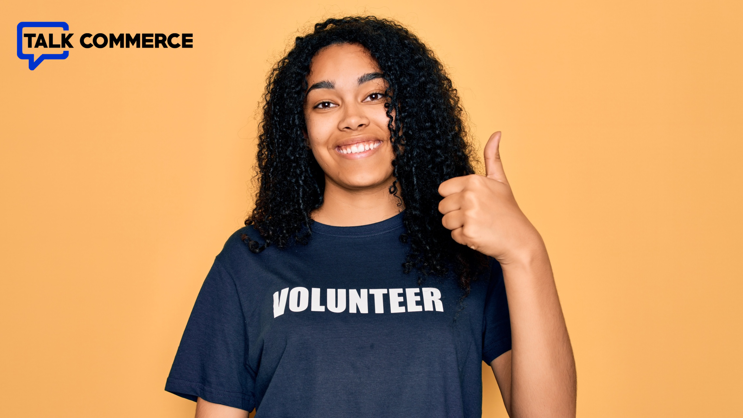 Image of a volunteer with a thumbs up